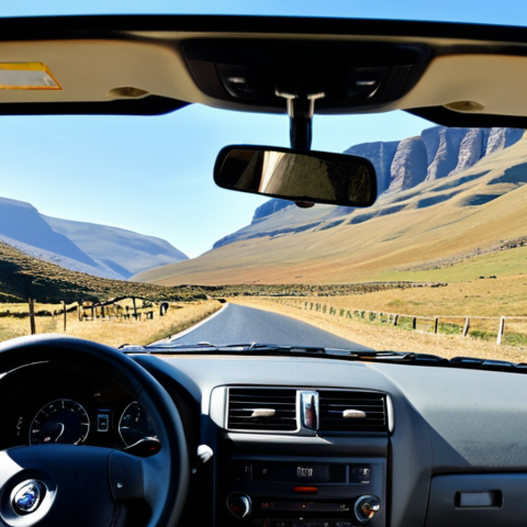 레소토에서 독립 여행하는 법 - Sani Pass Adventure**

"A sturdy 4x4 vehicle navigating the winding Sani Pass road, with dramatic mo...